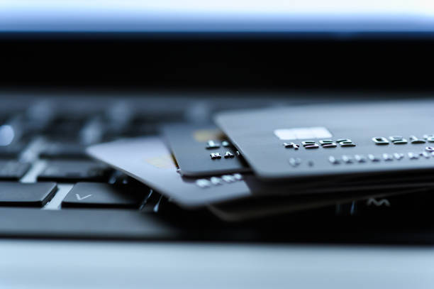 Close up shot of credit card on Laptop computer payment for purchases from online stores and online shopping. Concept of internet purchase. Selective focus for background. Close up shot of credit card on Laptop computer payment for purchases from online stores and online shopping. Concept of internet purchase. Selective focus for background charging stock pictures, royalty-free photos & images