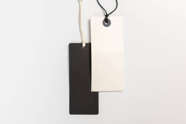 istock two fashionable blank labels for clothes on a gray background 1395468736