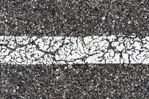 Street grain pattern. Cracked paint stipe.