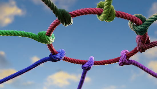 Colorful as diverse ropes connected together. Concept or metaphor of teamwork, collaboration and partnership successful