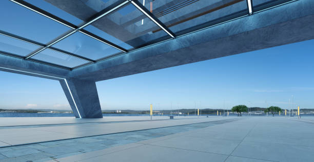 istock Perspective view of empty concrete floor and modern rooftop building 1395472557