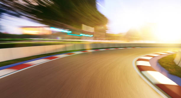 Motion blurred racetrack Motion blurred racetrack,golden hour mood motor racing track photos stock pictures, royalty-free photos & images
