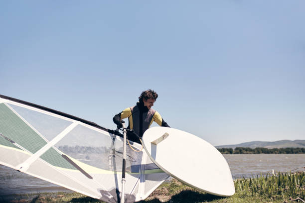 istock Windsurfer on a windy summertime day at the lake. 1395474020