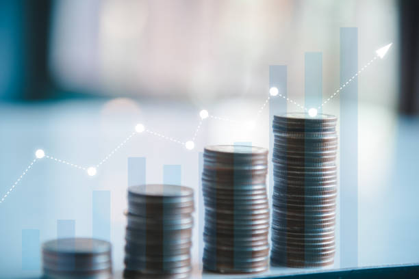 istock stacking coins with a graph of profit. Business successful growth. 1395475065