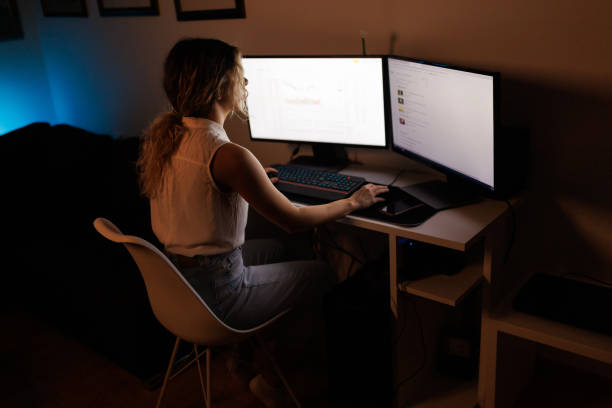 istock Woman trading cryptocurrency on a computer at home 1395477529