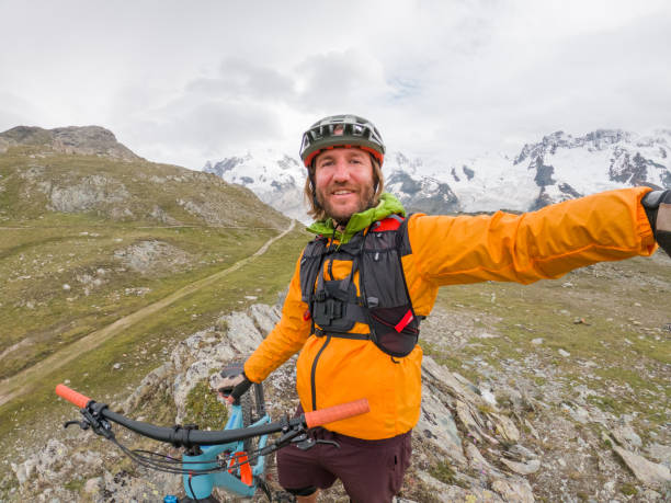 istock Mountain biker taking selfie on bicycle trail 1395477829