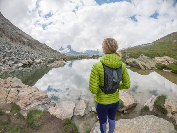 istock Female trail runner looking at view, overcast 1395479022