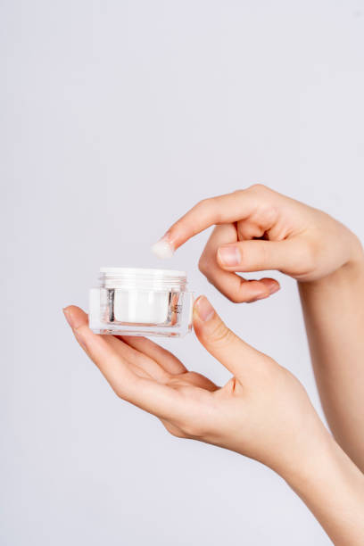 istock A young woman holds makeup in her hand 1395479342