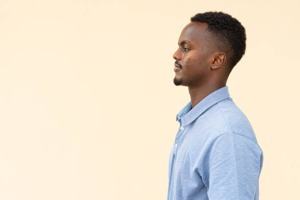 istock Profile view of young handsome black businessman 1395486893