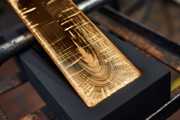 gold ingot in graphite casting form on workbench at plant - cast in stone imagens e fotografias de stock