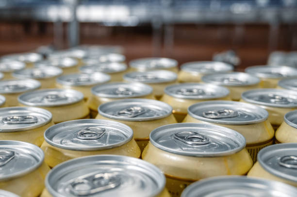 istock beer cans on the conveyor. 1395487997