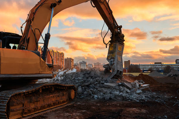 istock Excavator with concrete crusher on rig at demolition site 1395488170