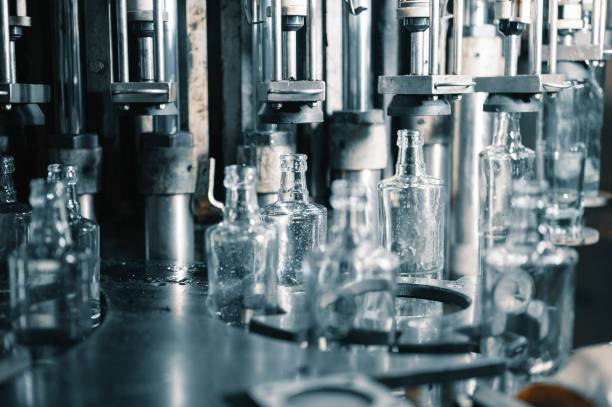 istock Automatic production line fills glass bottles with vodka 1395488258