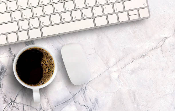 istock Morning black coffee and mini mouse and keyboard wireless on white marble background. 1395489644
