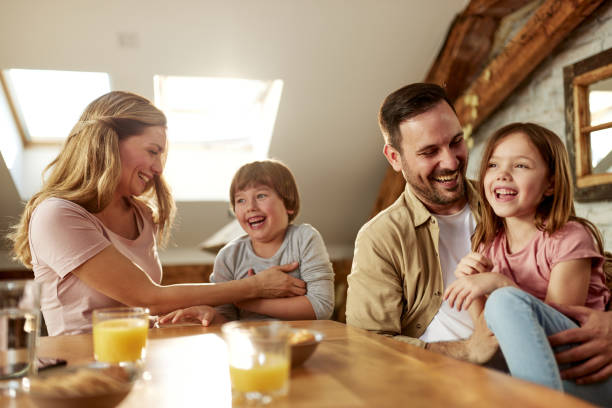 istock Cheerful family having fun in dining room. 1395490440