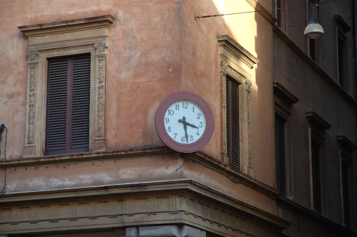 historical clock on buildings corner