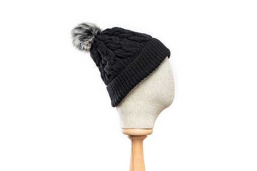 Black  knit hat/beanie with mannequin head on white background