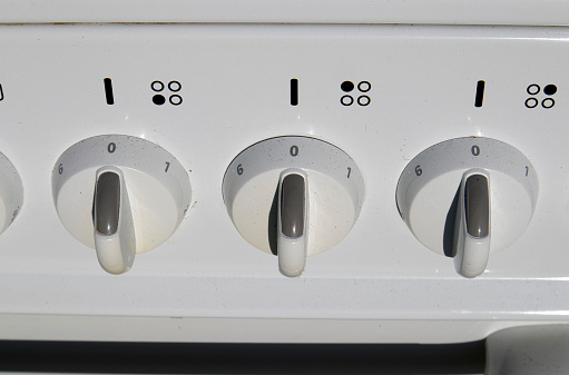 dusty electric kitchen stove control switches