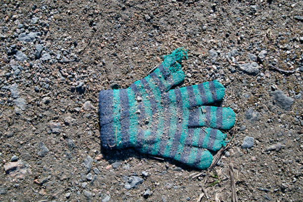Lost knitted child's glove on the ground