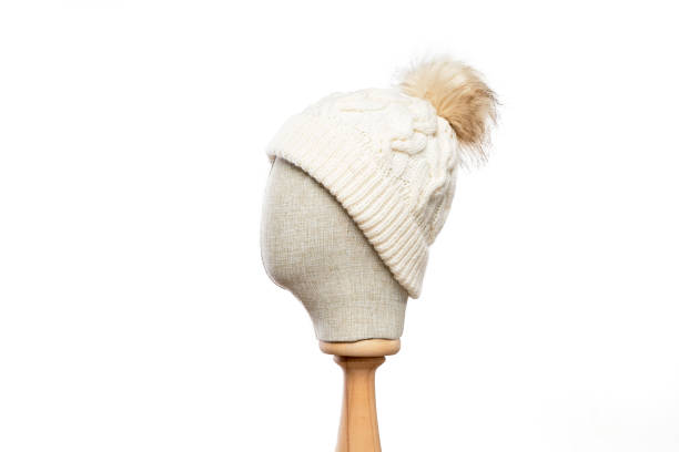 istock White knit beanie with mannequin head on white background 1395491851