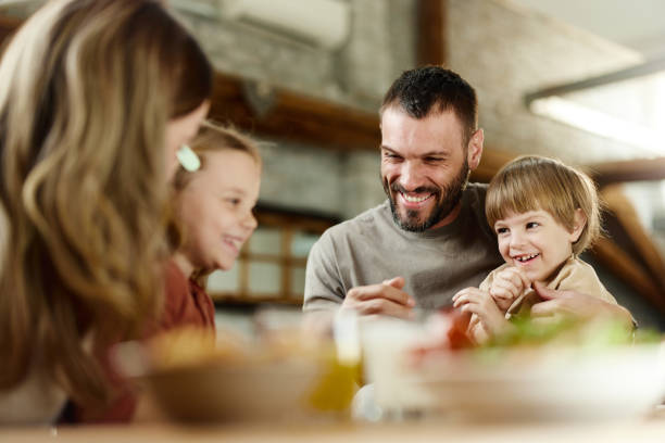 istock Happy family having fun during a meal in dining room. 1395491948
