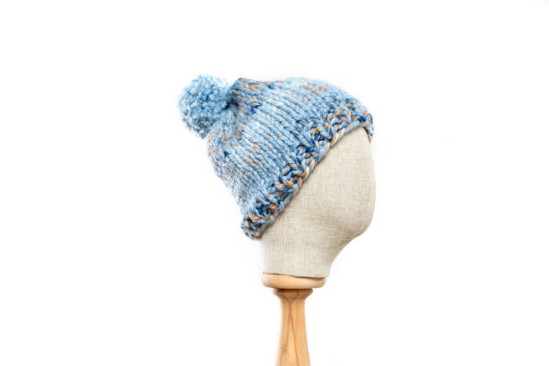 Blue knit hat/beanie with mannequin head on white background