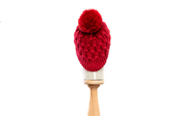 istock Red knit beanie with mannequin head on white background 1395492350