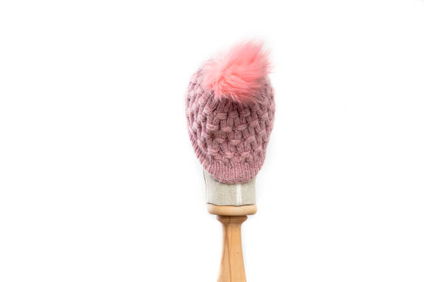 istock Pink knit beanie with mannequin head on white background 1395493158