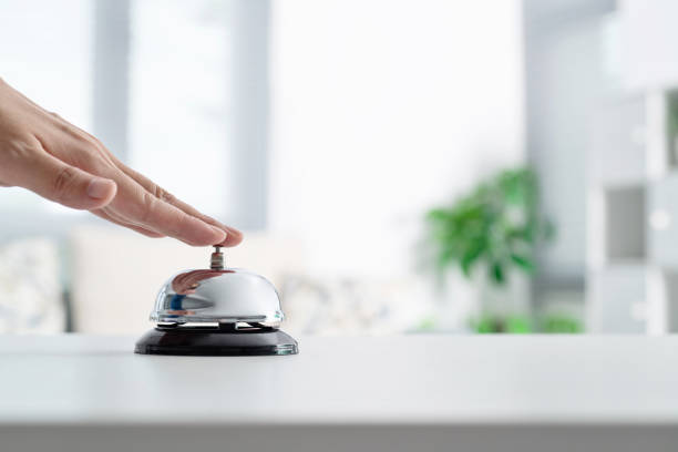 istock Woman hand ringing a service bell 1395493476