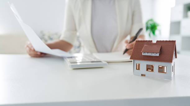 istock Real estate agent working on office 1395493504