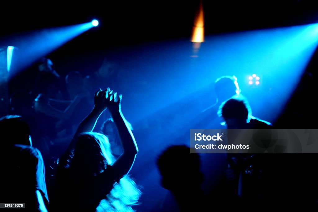 dancing people dancing people in an underground club Back Lit Stock Photo