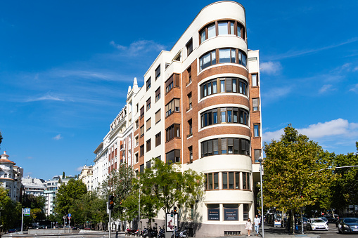 Madrid, Spain - October 10, 2021: Old luxury residential building in Serrano Street. Salamanca neighborhood is one of the wealthiest districts in the capital and a prime area for offices, houses and shops