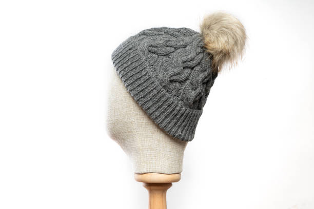 istock Gray knit beanie with mannequin head on white background 1395495378