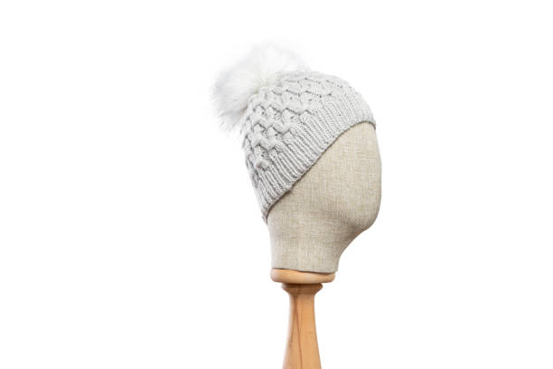 istock Gray knit beanie with mannequin head on white background 1395495442