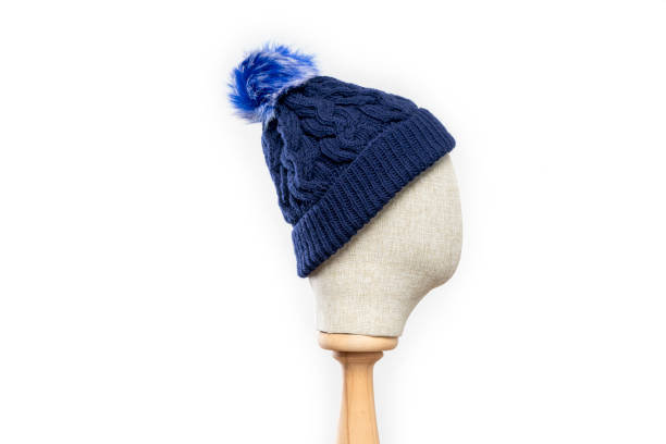 istock Navy blue knit beanie with mannequin head on white background 1395496363