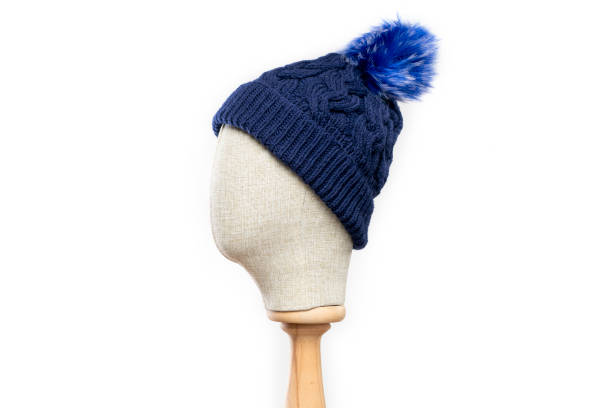 istock Navy blue knit beanie with mannequin head on white background 1395496517
