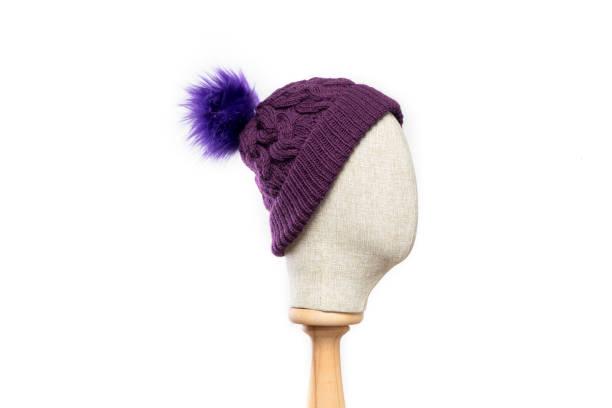 istock Purple knit beanie with mannequin head on white background 1395496642