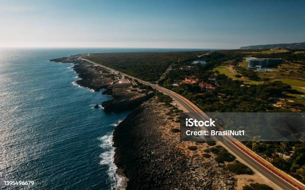 Aerial View Top Down View Of Of A Straight Road And Rugged Coastline At Guincho Beach Cascais Portugal Stock Photo - Download Image Now