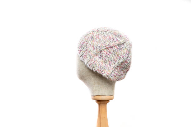 Gray knit beanie with mannequin head on white background
