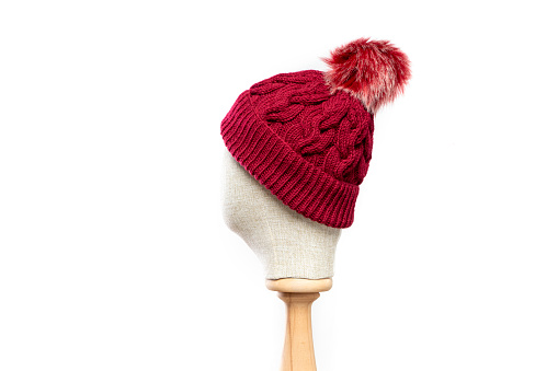Red  knit hat/beanie with mannequin head on white background