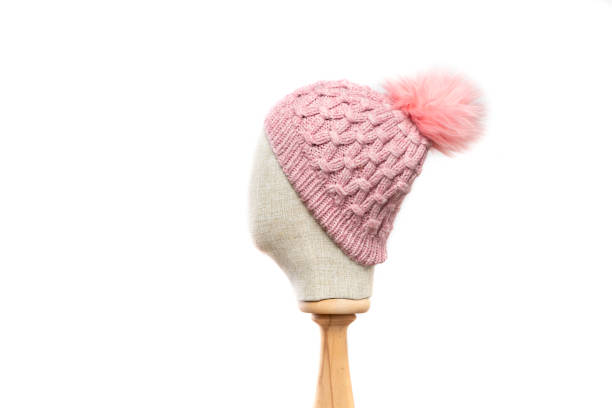 istock Pink knit beanie with mannequin head on white background 1395496822