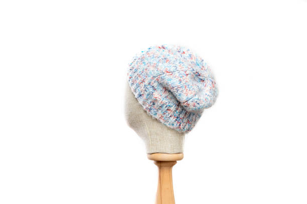 Blue knit hat/beanie with mannequin head on white background