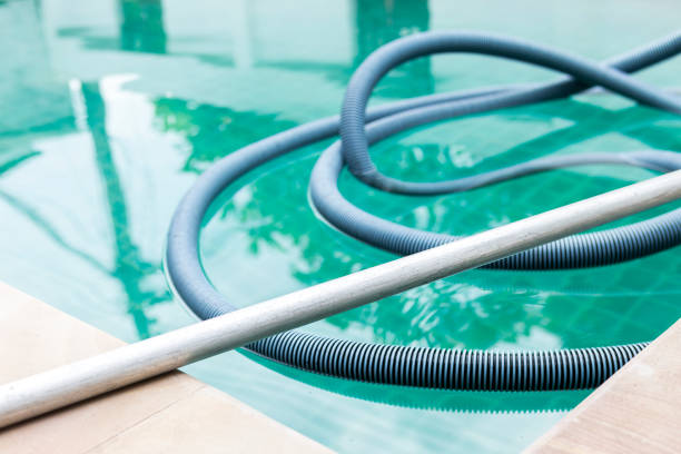 istock Swimming pool vacuum hose for cleaning service 1395496919
