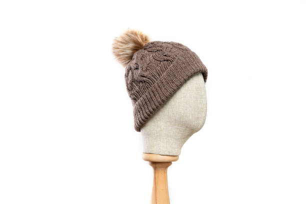 istock Brown knit beanie with mannequin head on white background 1395497519