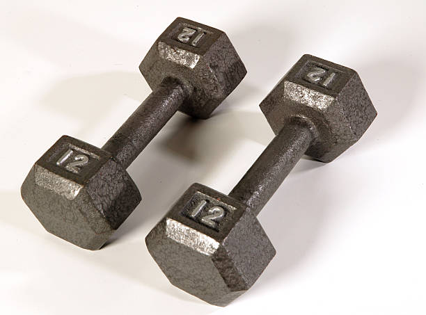 istock piar of 12 lb silver dumbells 139549761