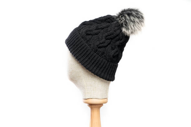 istock Black knit beanie with mannequin head on white background 1395497764