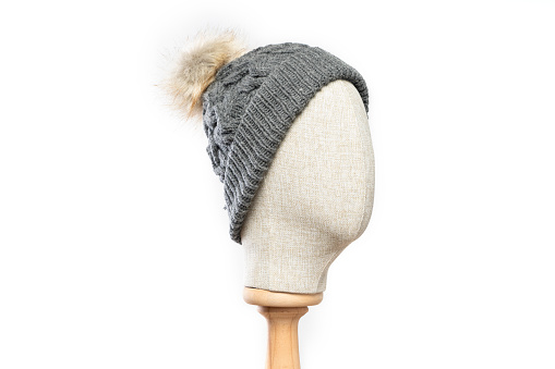 Gray knit hat/beanie with mannequin head on white background