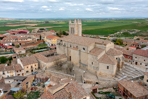 Gaillon, France - August 05 2022: Aerial view of the bell tower of the Saint-Ouen church overlooking the rest of the village.