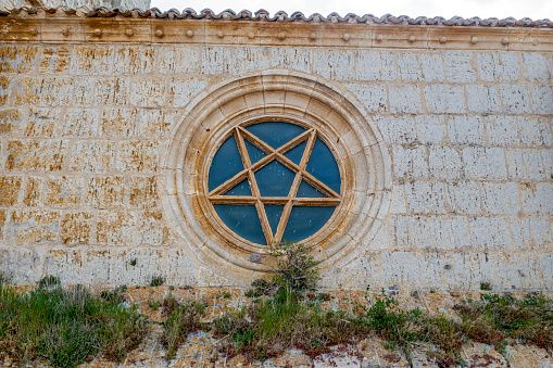 Church of San Juan in Castrojeriz, Burgos Spain dating from the thirteenth century. Rosette superb specimen of pentagram pentagon traditionally invested mystical symbolism.
