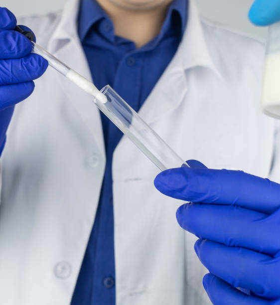 Semen in a test tube. Reproductive system check. Donor suitability test for artificial insemination. Medical laboratory assistant checks a test tube with sperm. Spermogram. Male fertility test. el asistente de laboratorio médico revisa un tubo de ensayo con esperma. espermograma. prueba de fertilidad masculina. semen en un tubo de ensayo. comprobación del sistema reproductivo. prueba de idoneidad del donante para la inseminación artificial